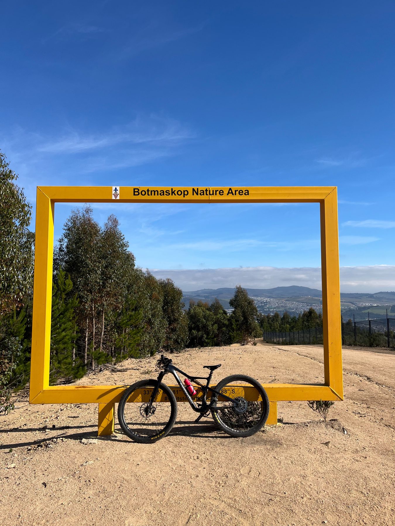 Mountain bike parked at the Botmaskop Nature Area photo frame overlooking Stellenbosch