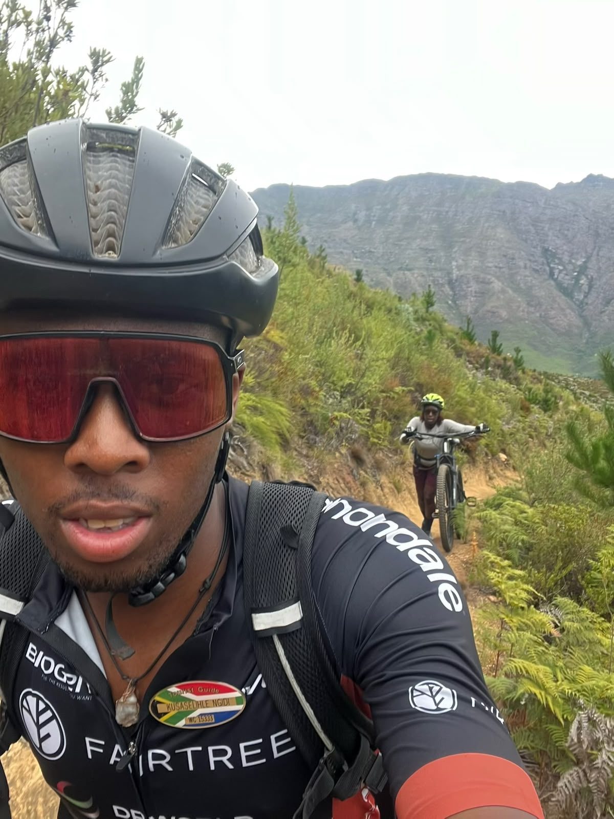 Kusaselihle 'Lihle' Ngidi in Fairtree race kit on a Cape Winelands mountain bike trail